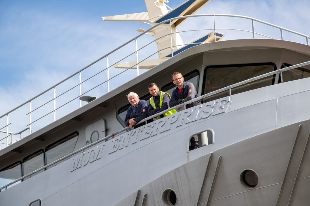 Marshall Jakeman's founder Barry Marshall and Steel Benders UK's Phil Anderson (hi vis) look on as the Marshall Art heads on to the River Tees. Pictures: Tom Banks